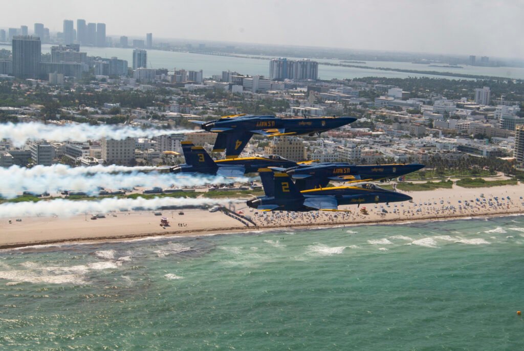 Blue Angels fly in close formation over Pensacola Beach during a flight demonstration.