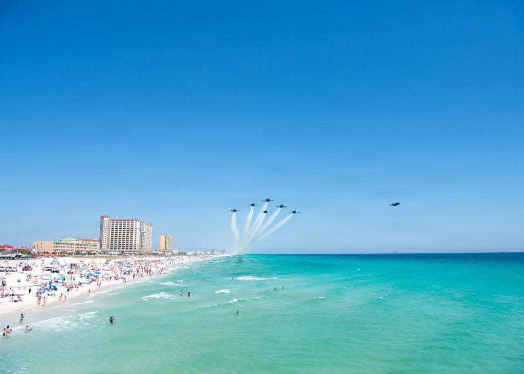 Blue Angels fly in formation over Pensacola Beach, Florida, during a flight demonstration.