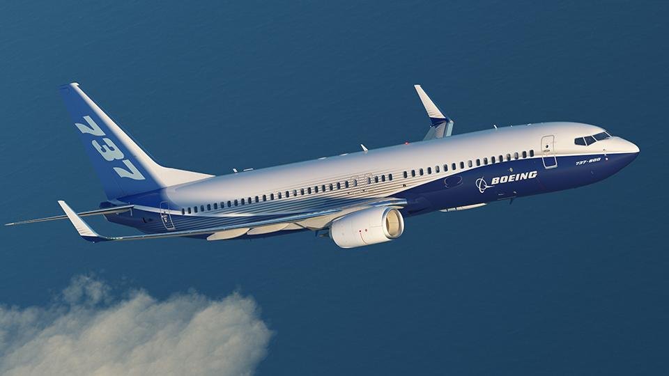 Boeing 737-800 climbing over water, a Next Generation variant