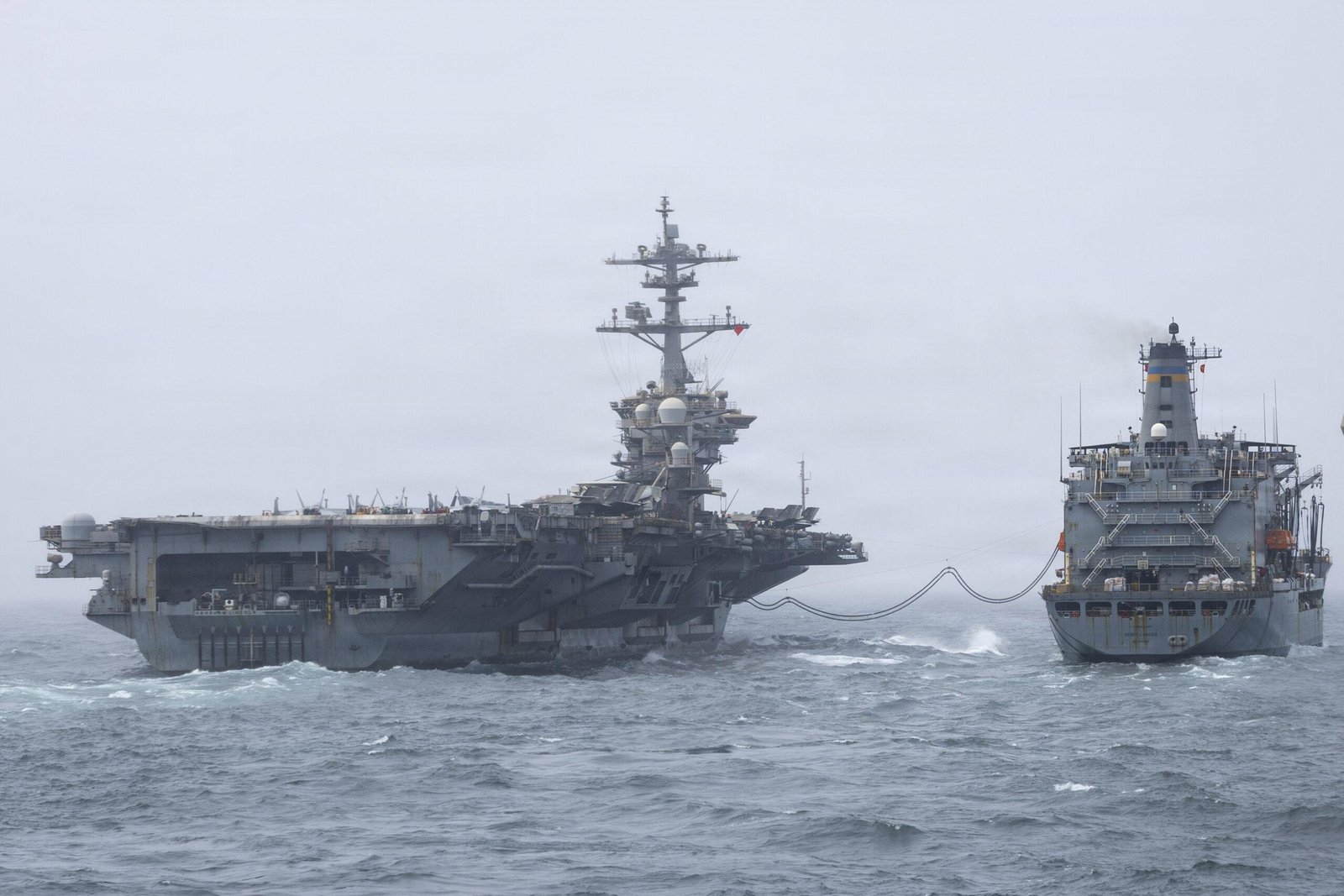USS Abraham Lincoln returning home conducts replenishment-at-sea during extended deployment