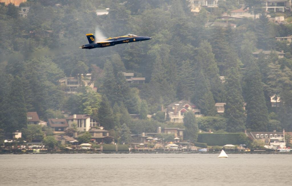 A U.S. Navy Blue Angels F/A-18 flies low over Lake Washington during the 2017 Boeing Seafair Air Show.