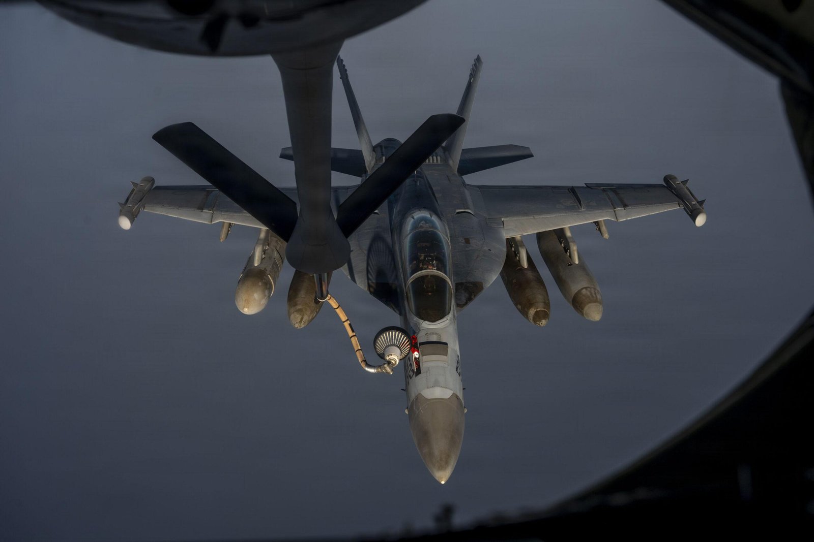 EA-18G Growler taking on fuel from a tanker via hose and drogue