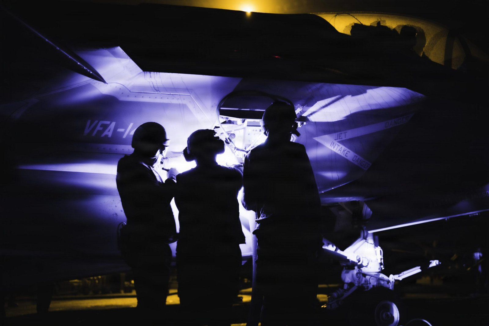VFA-14 maintainers inspect aircraft aboard USS George Washington