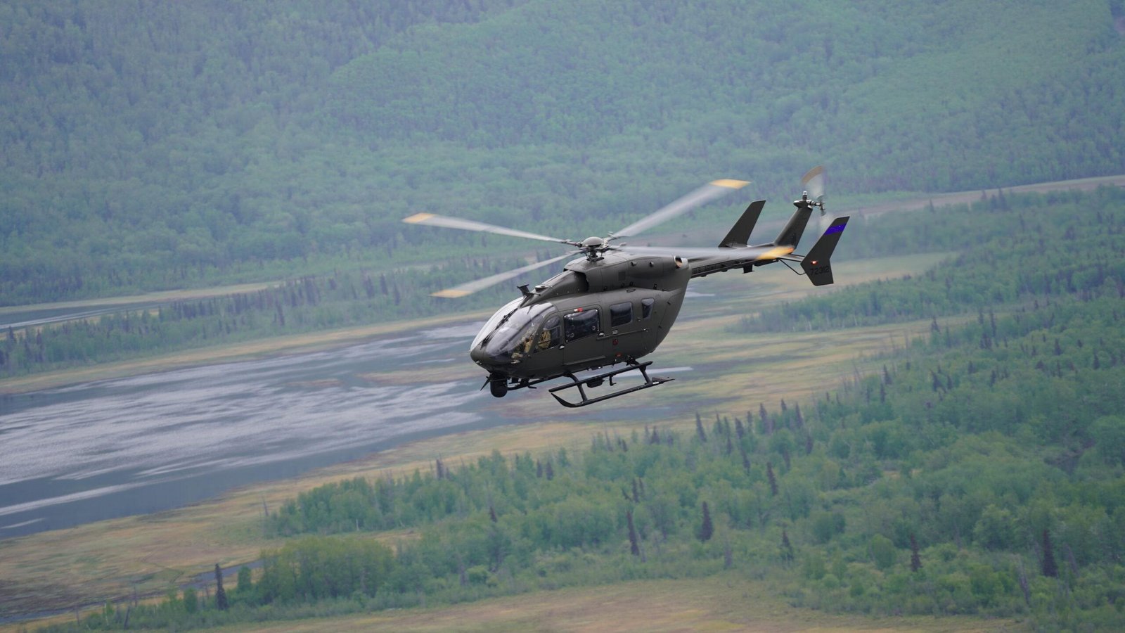 Alaska Army National Guard UH-72 Lakota helicopter flying over the Matanuska River during a training mission