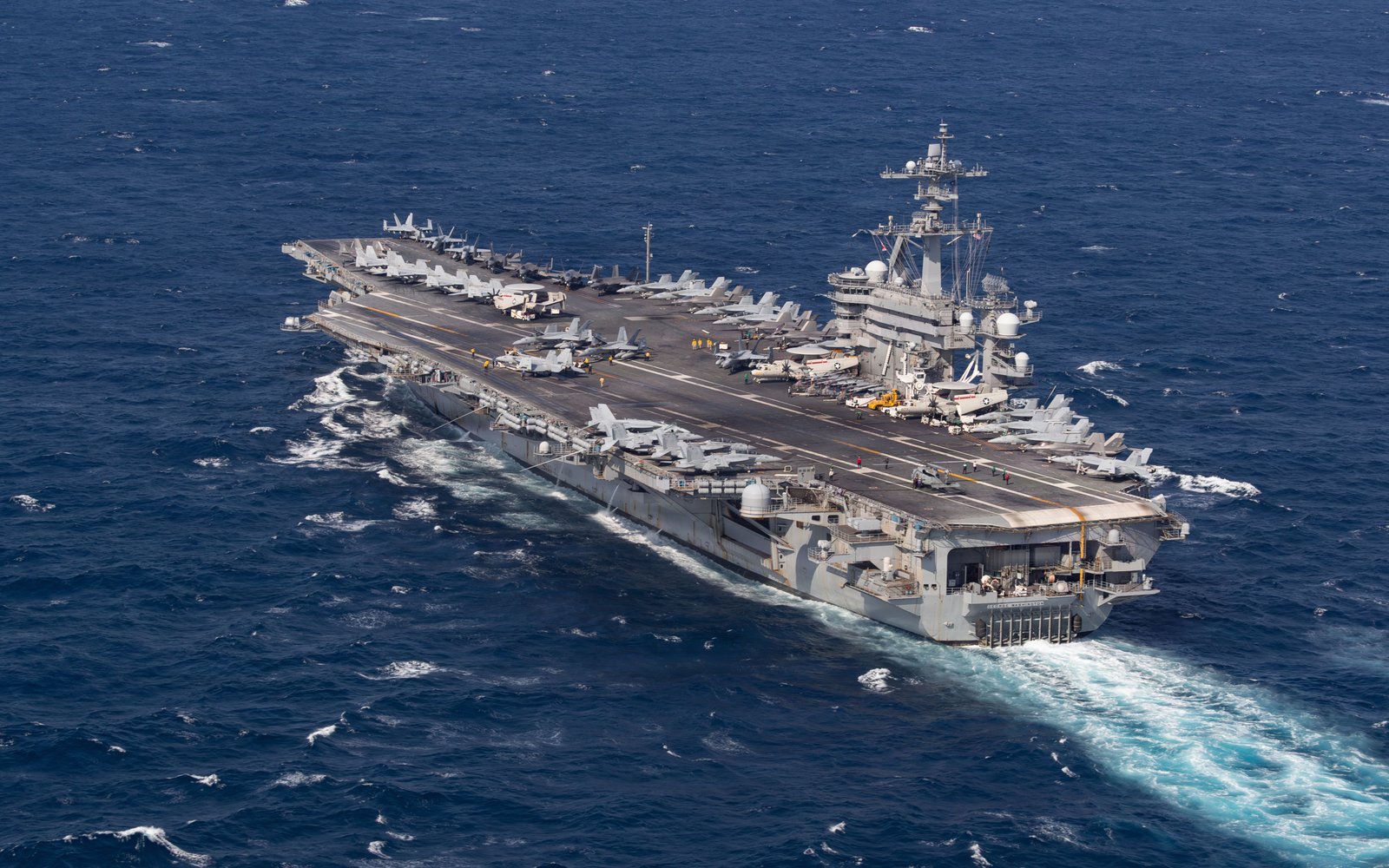 USS George Washington aircraft carrier underway ahead of relieving USS Abraham Lincoln
