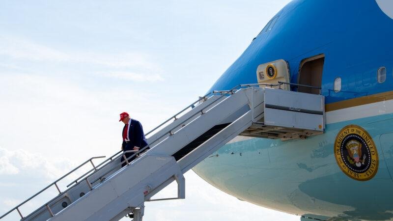 President Trump walks down the stairs of the VC-25A Air Force One on the tarmac