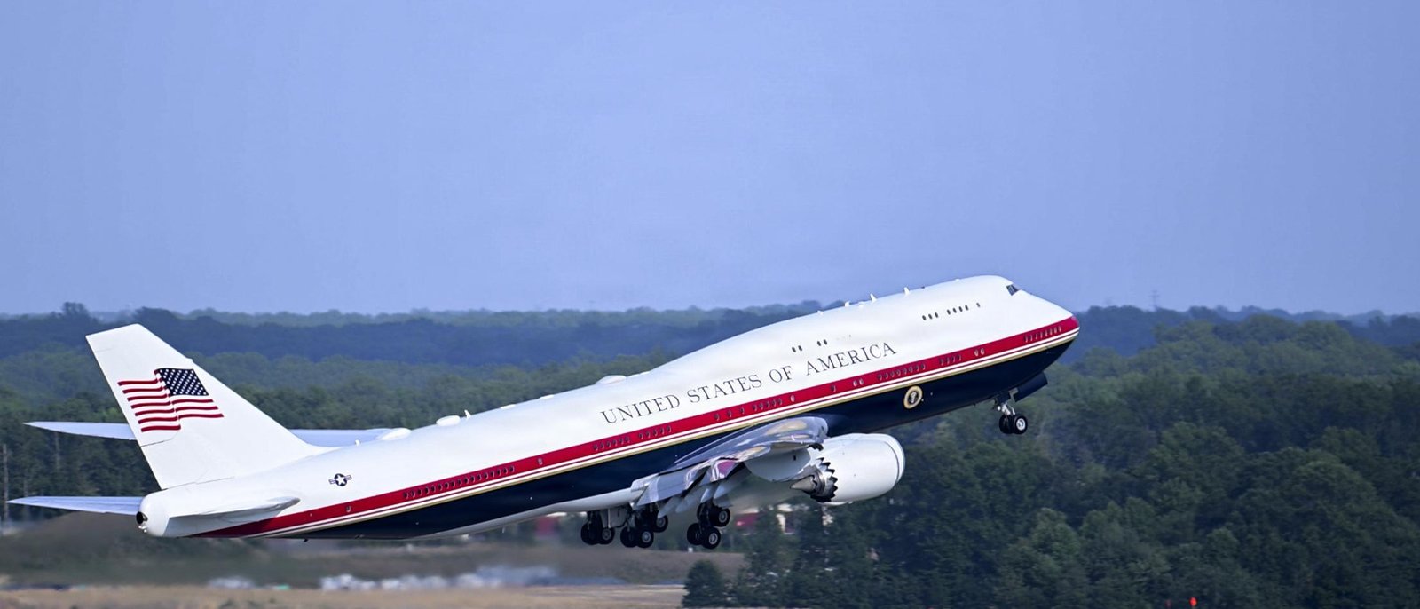 New Air Force One Boeing 747 climbing out after takeoff against clear sky