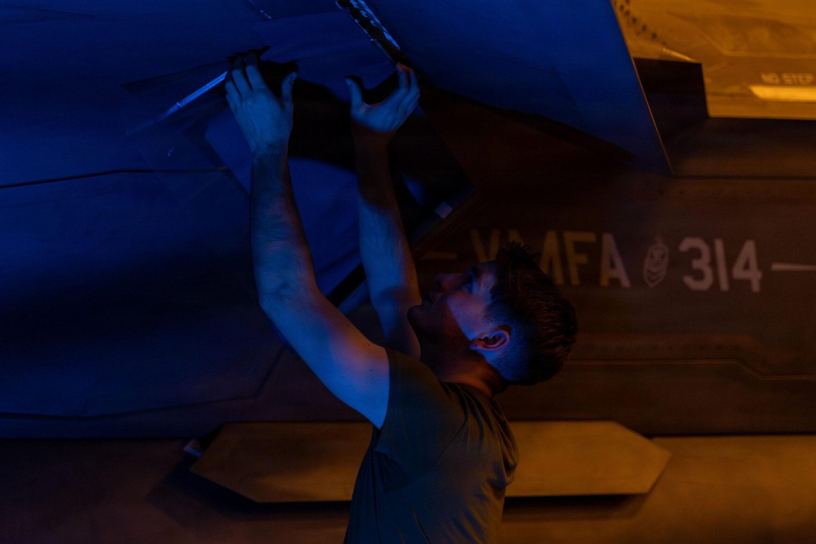 F-35C Low Observable Coating Repair Aboard USS Abraham Lincoln Marine Corps maintainer performs a low observable coating repair on an F-35C Lightning II in the hangar bay of USS Abraham Lincoln