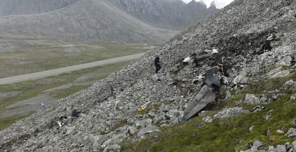 NTSB investigators document the wreckage field of the Cape Newenham, Alaska crash site on a steep mountainside, Aug. 23, 2026