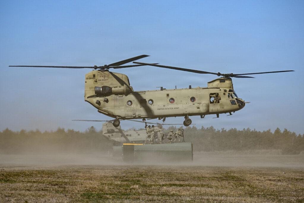 U.S. Army CH-47F Chinook helicopter, one of the platforms equipped with the CIRCM missile defense system, lifts a cargo container during sling load training