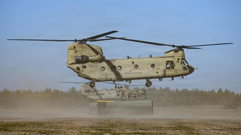 U.S. Army CH-47F Chinook helicopter, one of the platforms equipped with the CIRCM missile defense system, lifts a cargo container during sling load training