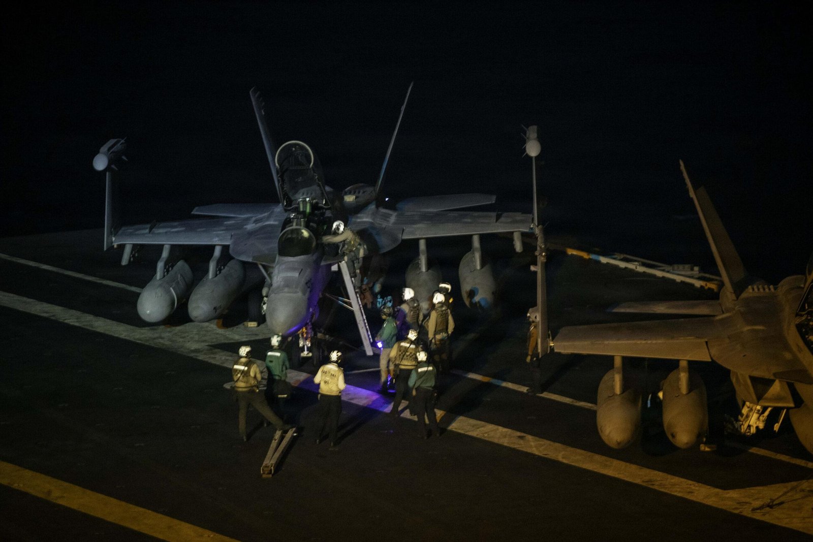 Auto GCAS Super Hornet: EA-18G Growler on carrier flight deck at night