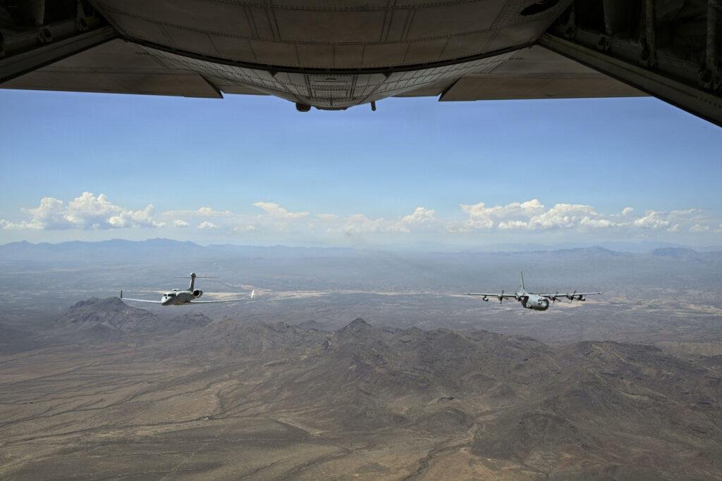 EC-130H final flight: EA-37B and EC-130H Compass Call in close formation over Arizona