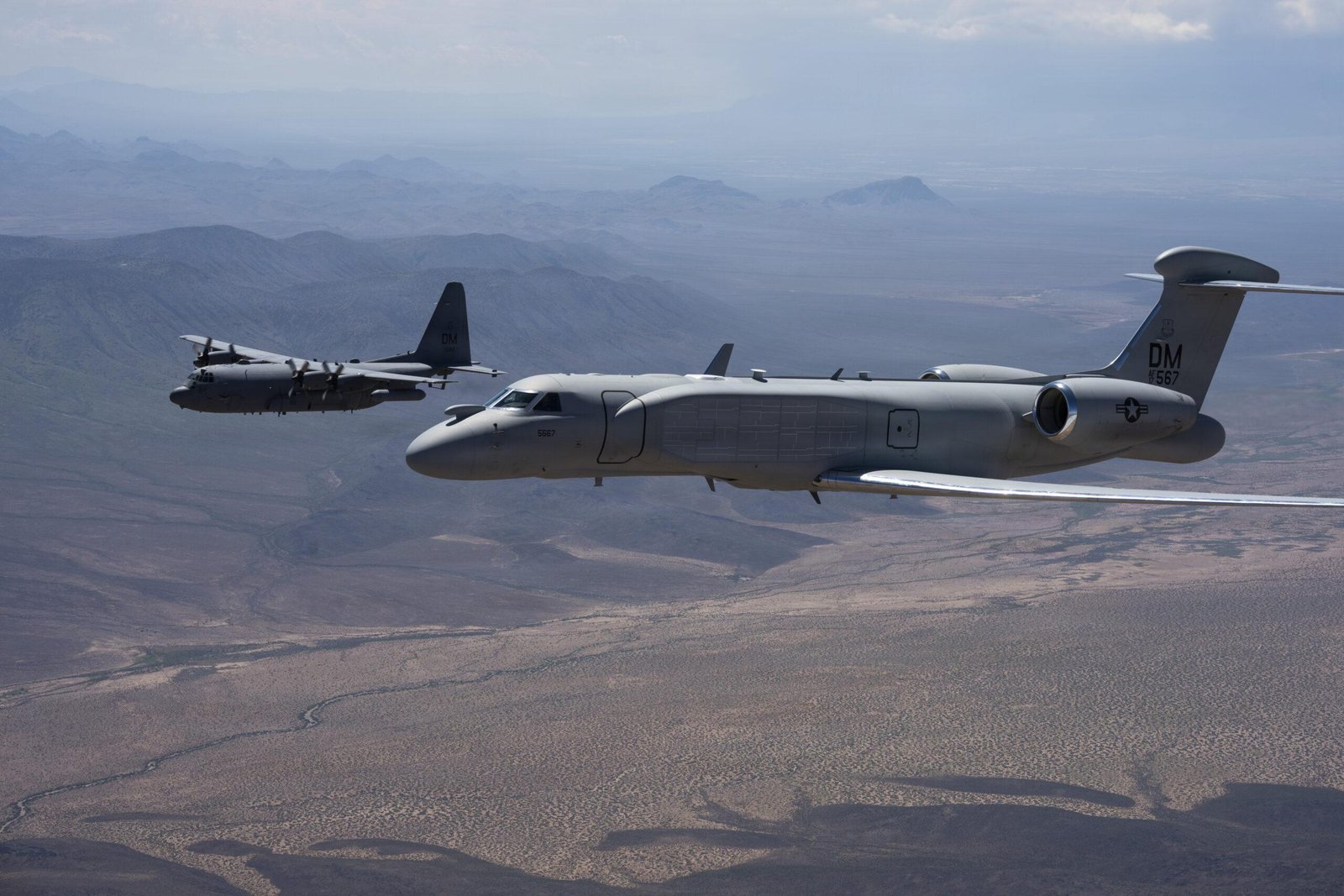EC-130H final flight: EA-37B and EC-130H Compass Call in close formation over Arizona