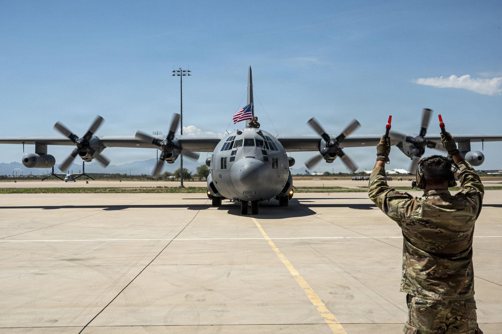 EC-130H final flight: EC-130H Compass Call marshalled on the ramp at Davis-Monthan