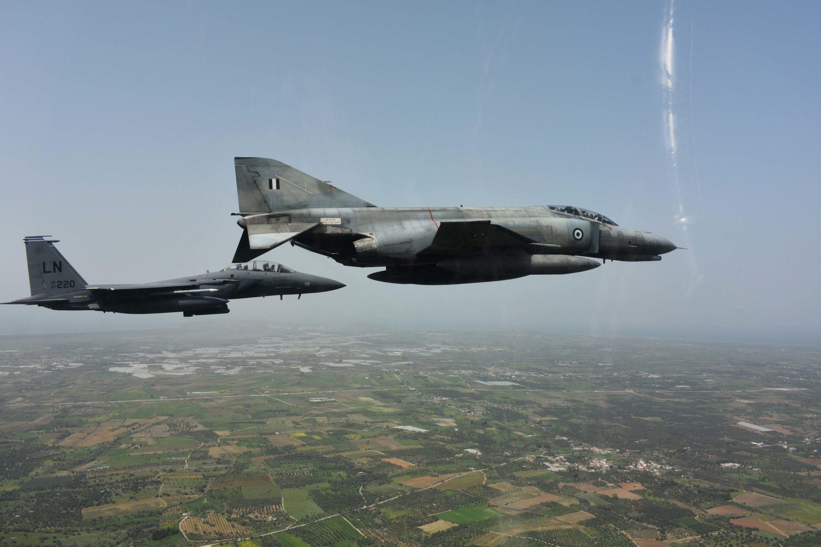 Hellenic Air Force F-4E Phantom II, the same aircraft type involved in the Athens Flying Week crash, flying with a U.S. Air Force F-15E during Exercise INIOCHOS 22