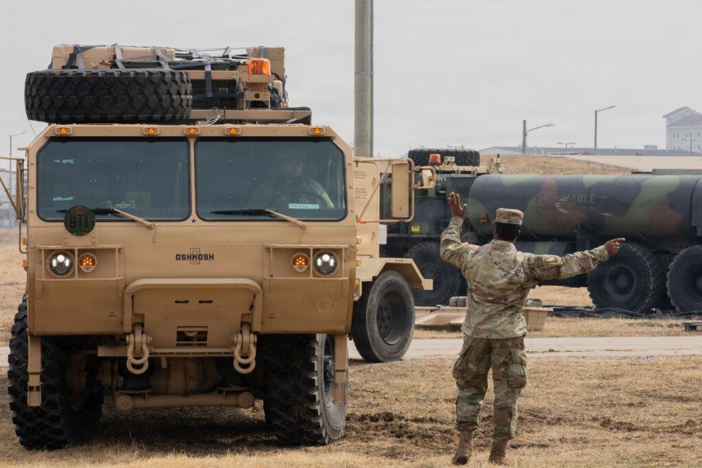 Enduring Shield interceptor: U.S. Army soldier directs support vehicles during IFPC operations at Camp Humphreys, South Korea