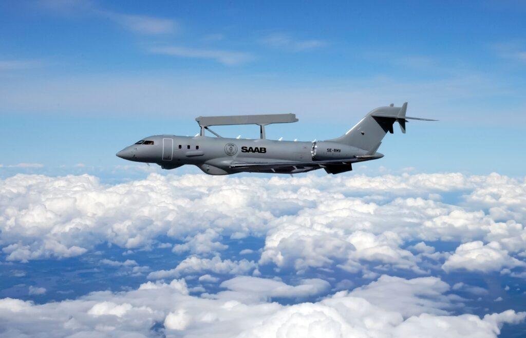 Saab GlobalEye airborne early warning and control aircraft flying above the clouds
