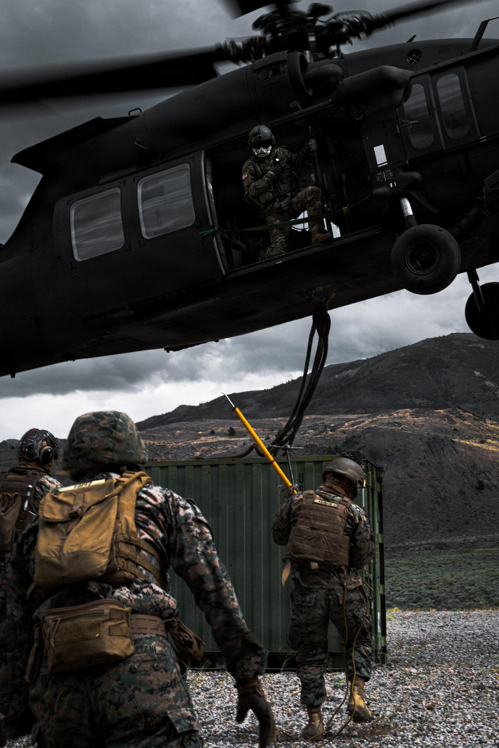 Argentina Black Hawk sale: U.S. Army UH-60L crew chief in the cabin doorway during external load training