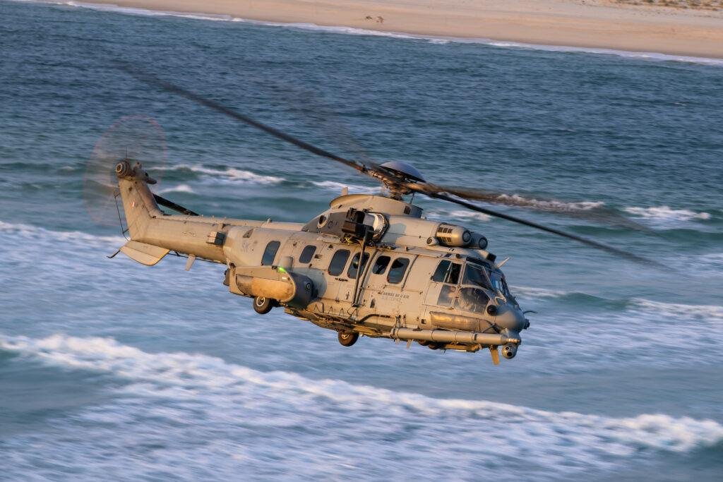 Romania H225M helicopters order illustrated by an Airbus H225M conducting a special forces rope operation over water.
