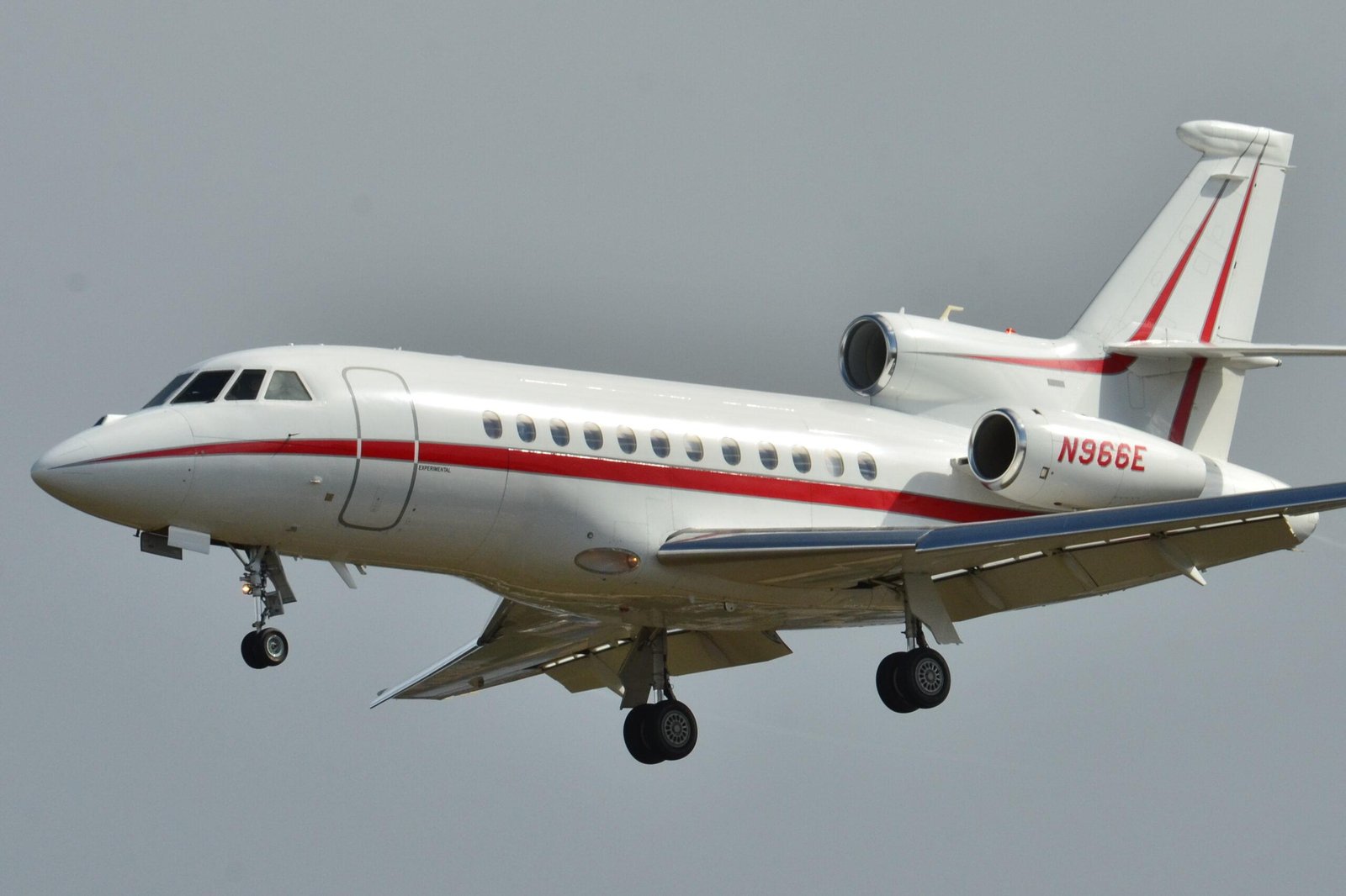 Honeywell business forecast illustrated by Dassault Falcon 900EX jet N966E landing at Toulouse-Blagnac Airport