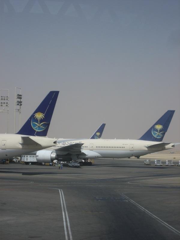 Saudi airport attacks coverage illustrated by Saudi Arabian Airlines Boeing 777 aircraft parked at King Khalid International Airport in Riyadh.