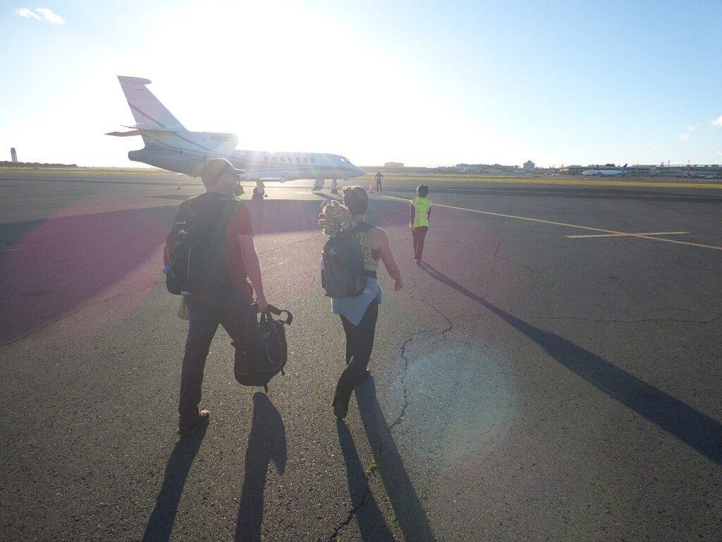 Passengers boarding a Dassault Falcon 50 business jet at Signature Flight Support in Honolulu in June 2022.