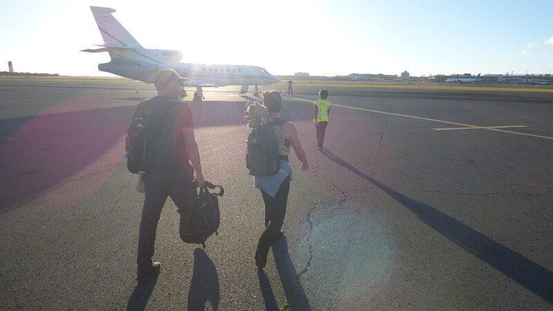 Passengers boarding a Dassault Falcon 50 business jet at Signature Flight Support in Honolulu in June 2022.