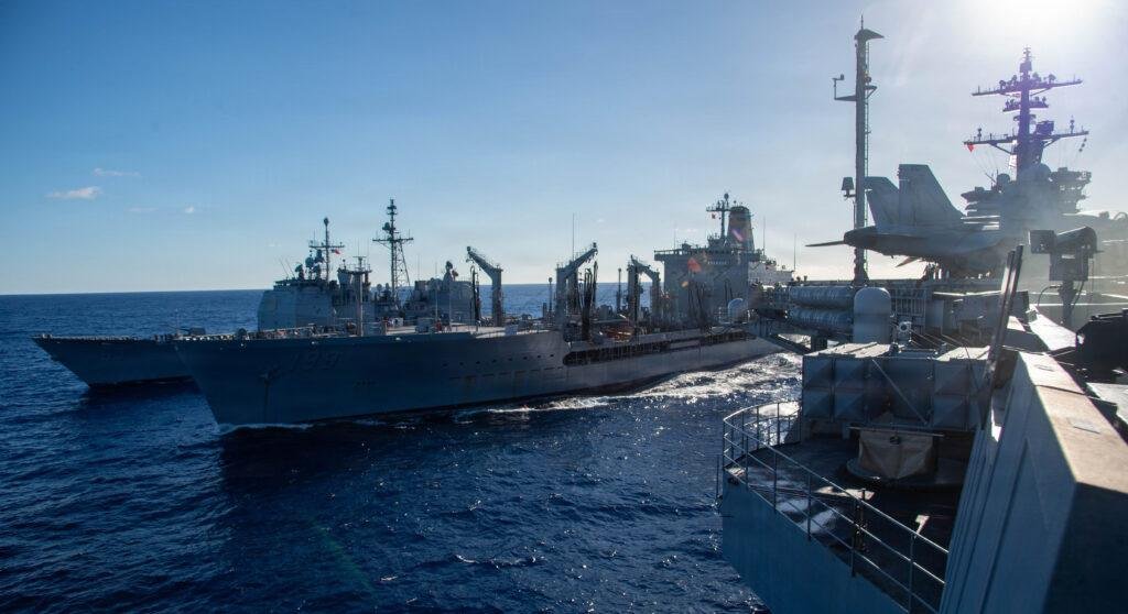 USS Theodore Roosevelt conducts a replenishment at sea with USS Chosin and USNS Tippecanoe in the Pacific Ocean.