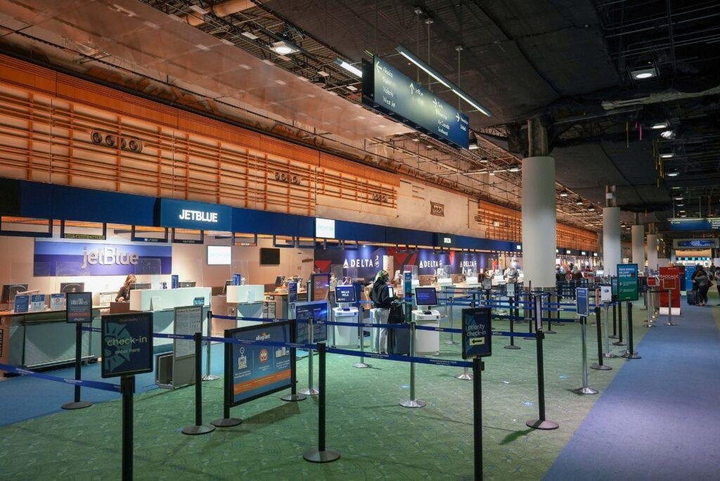 Airline Fares Rise — airline check-in counters at Portland International Airport, illustrating higher U.S. airline ticket prices in September 2026.