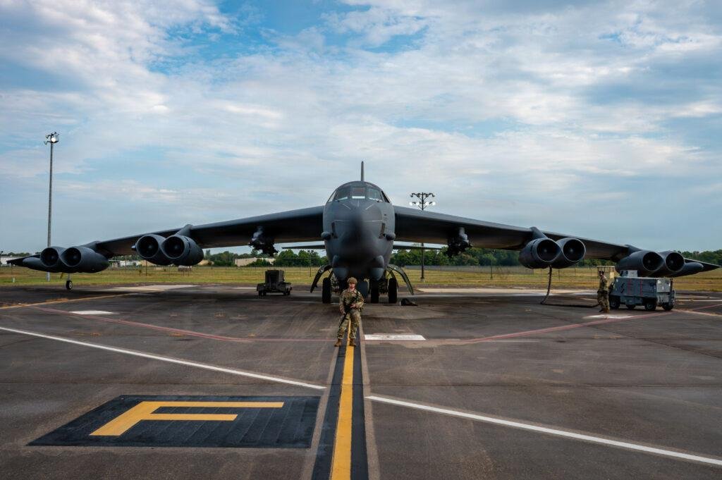 B-52 LRASM integration article illustrated by a U.S. Air Force B-52H Stratofortress bomber parked at Barksdale Air Force Base during a military exercise.
