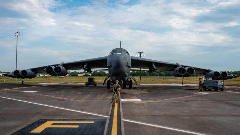 B-52 LRASM integration article illustrated by a U.S. Air Force B-52H Stratofortress bomber parked at Barksdale Air Force Base during a military exercise.