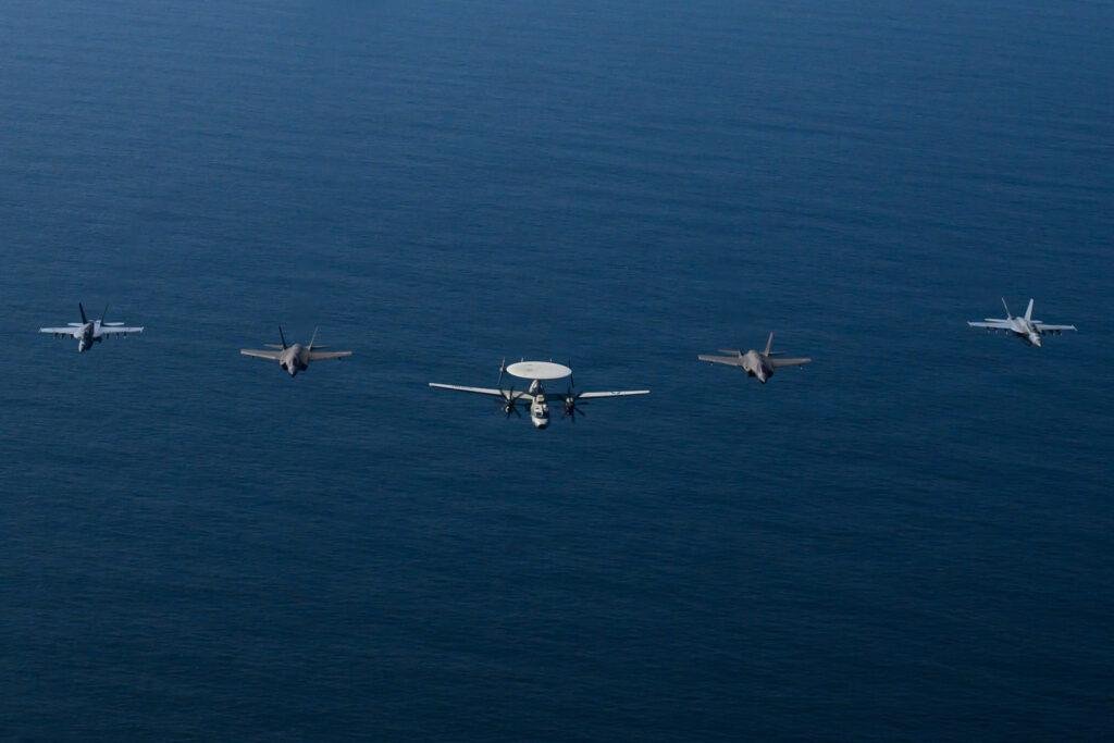 Carrier Air Wing 9 aircraft fly in formation over the Arabian Sea during the USS Abraham Lincoln deployment in February 2026.