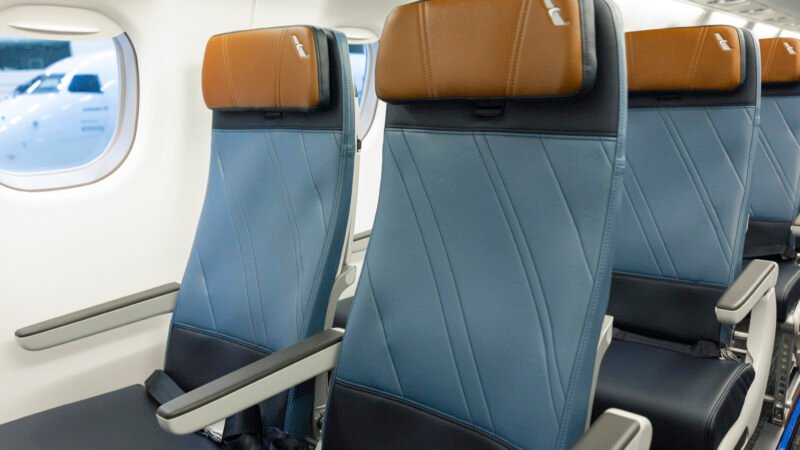 Embraer E175 Seats featuring blue upholstery and tan RECARO headrests in the new American Eagle regional jet cabin.