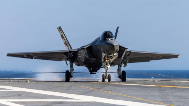 F-35C Kennedy landing showing a U.S. Navy F-35C Lightning II touching down on the aircraft carrier's flight deck.