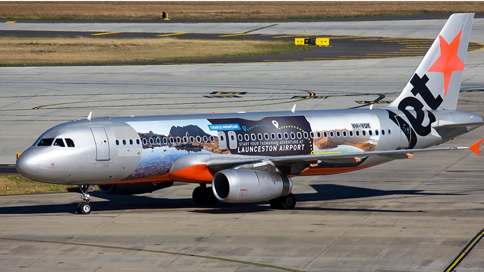 Jetstar Perth crew base expansion illustrated by a Jetstar Airbus A320 featuring Launceston Airport promotional livery on an airport taxiway.