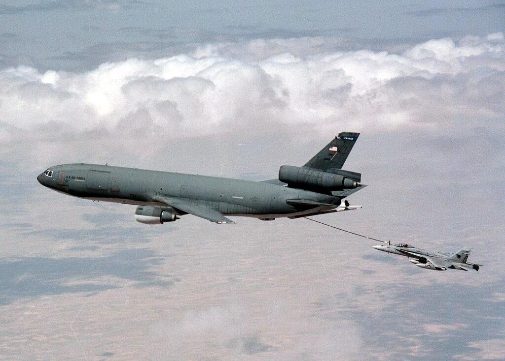 KC-10 North Africa transfer article illustrated by a U.S. Air Force KC-10 Extender refueling a Navy F/A-18C Hornet over Kuwait.