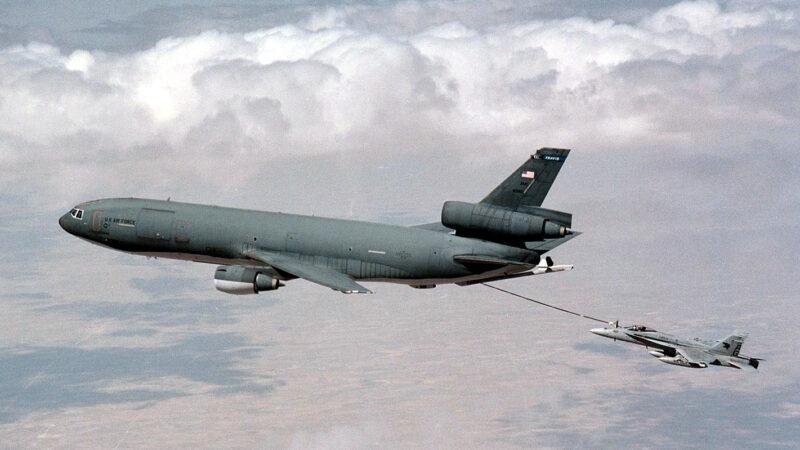 KC-10 North Africa transfer article illustrated by a U.S. Air Force KC-10 Extender refueling a Navy F/A-18C Hornet over Kuwait.
