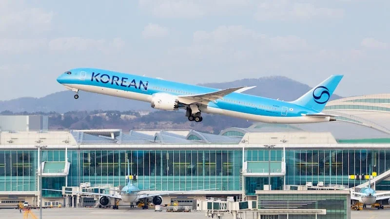 Korean Air Results illustrated by a Korean Air Boeing 787 Dreamliner taking off above an airport terminal in South Korea.