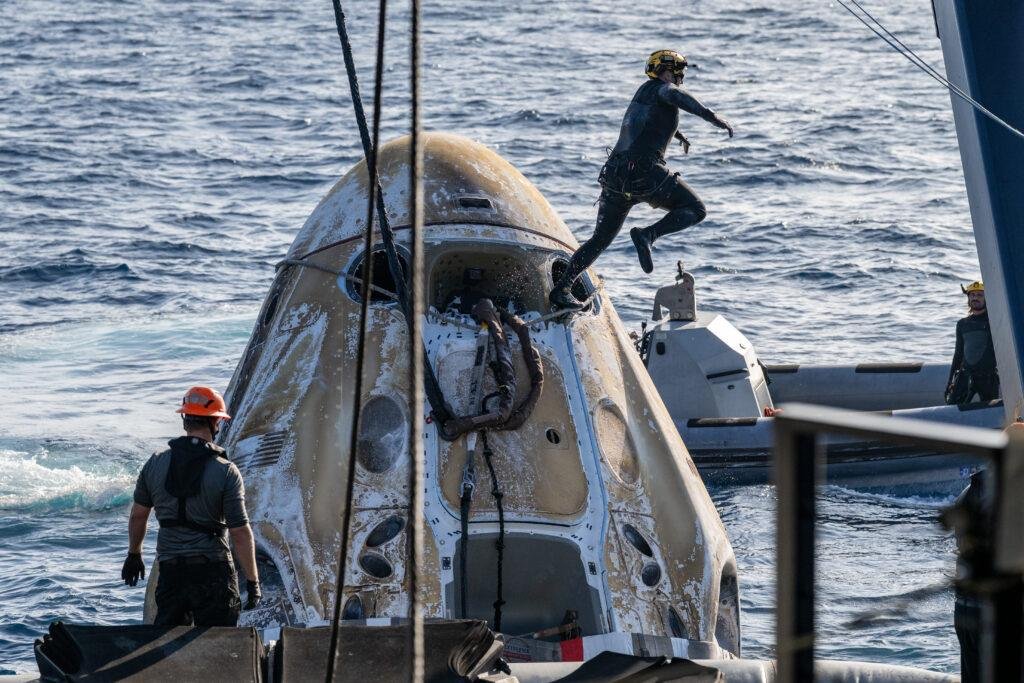 NASA Crew-12 return showing astronaut Jessica Meir receiving assistance aboard the SpaceX recovery ship SHANNON following splashdown.