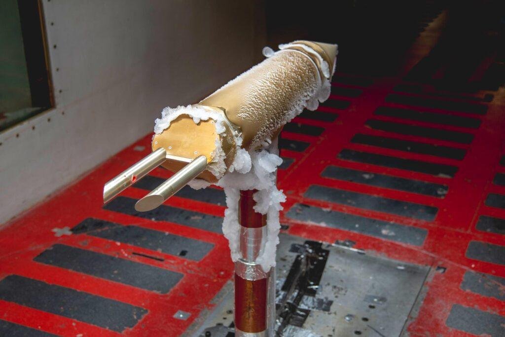NASA icing research test probe coated in ice inside the Glenn Icing Research Tunnel.