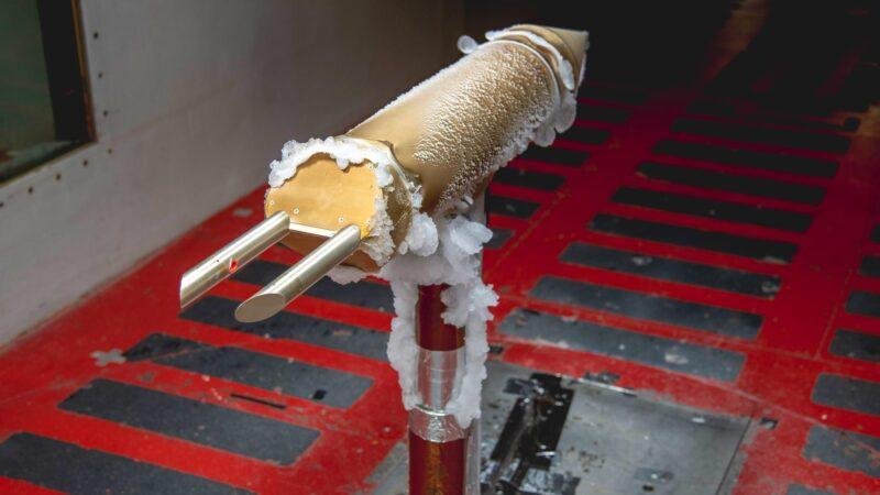 NASA icing research test probe coated in ice inside the Glenn Icing Research Tunnel.