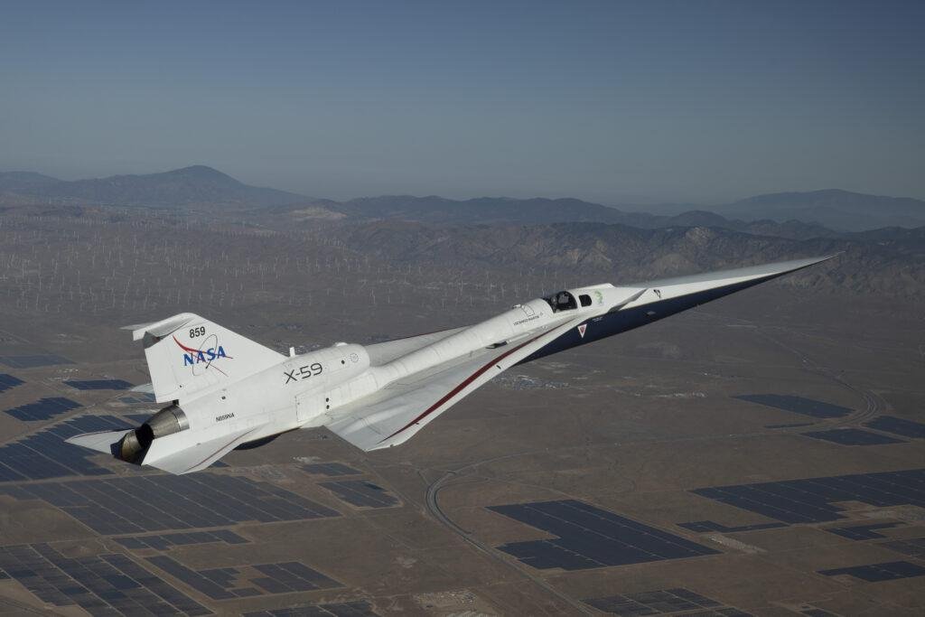 NASA X-59 Maintenance illustrated by the X-59 quiet supersonic research aircraft flying above the California desert and mountains.