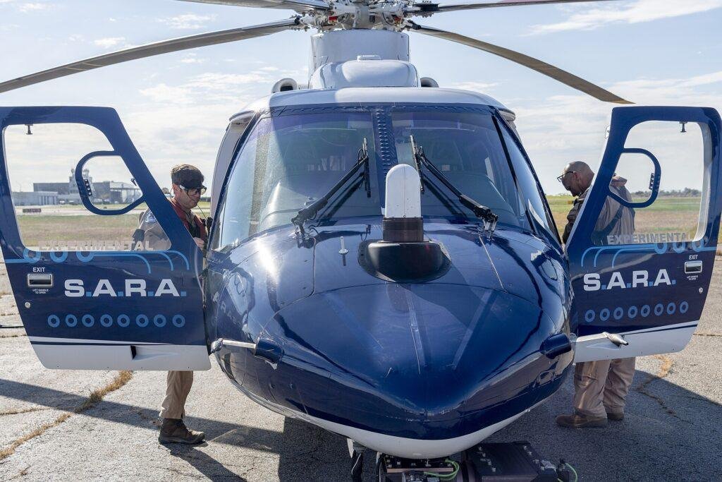 Sikorsky Nomad 100 development context: NASA pilot and Sikorsky safety pilot beside SARA autonomy test aircraft in 2023