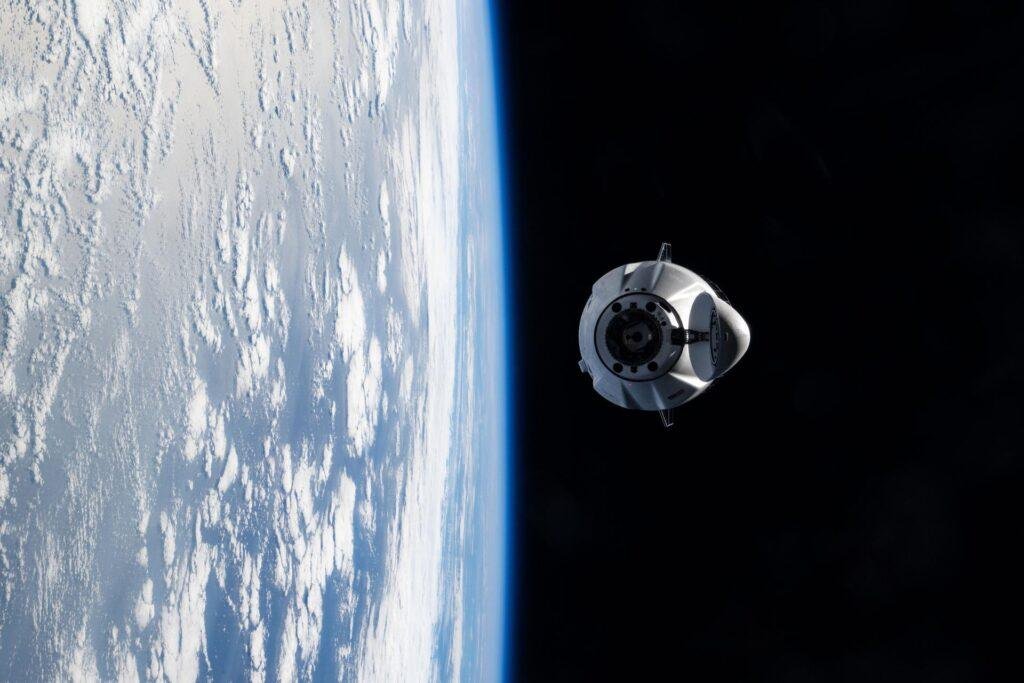 SpaceX CRS-35 launch preparations illustrated by a NASA photo of a cargo Dragon spacecraft approaching the ISS on the earlier CRS-33 mission.