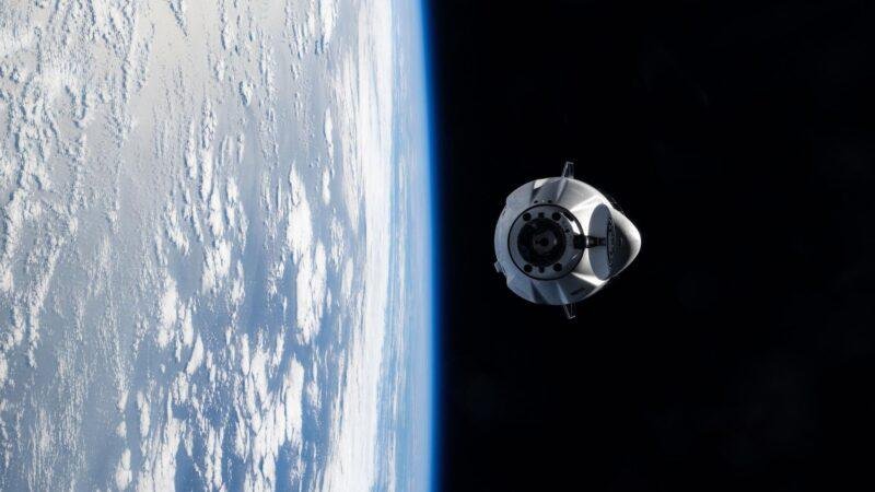 SpaceX CRS-35 launch preparations illustrated by a NASA photo of a cargo Dragon spacecraft approaching the ISS on the earlier CRS-33 mission.