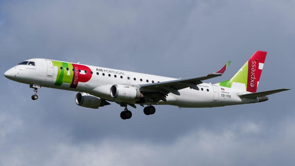 TAP Express Embraer Deal illustrated by a TAP Express Embraer E190 regional passenger jet approaching an airport with landing gear extended.
