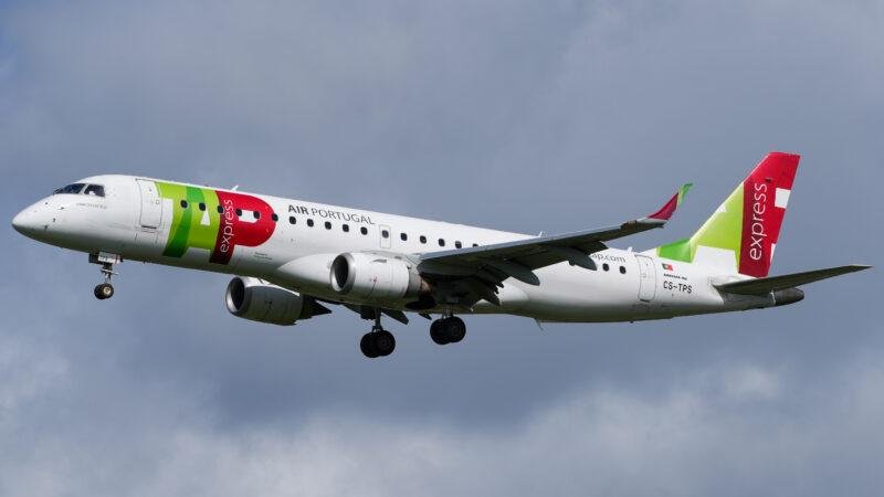 TAP Express Embraer Deal illustrated by a TAP Express Embraer E190 regional passenger jet approaching an airport with landing gear extended.