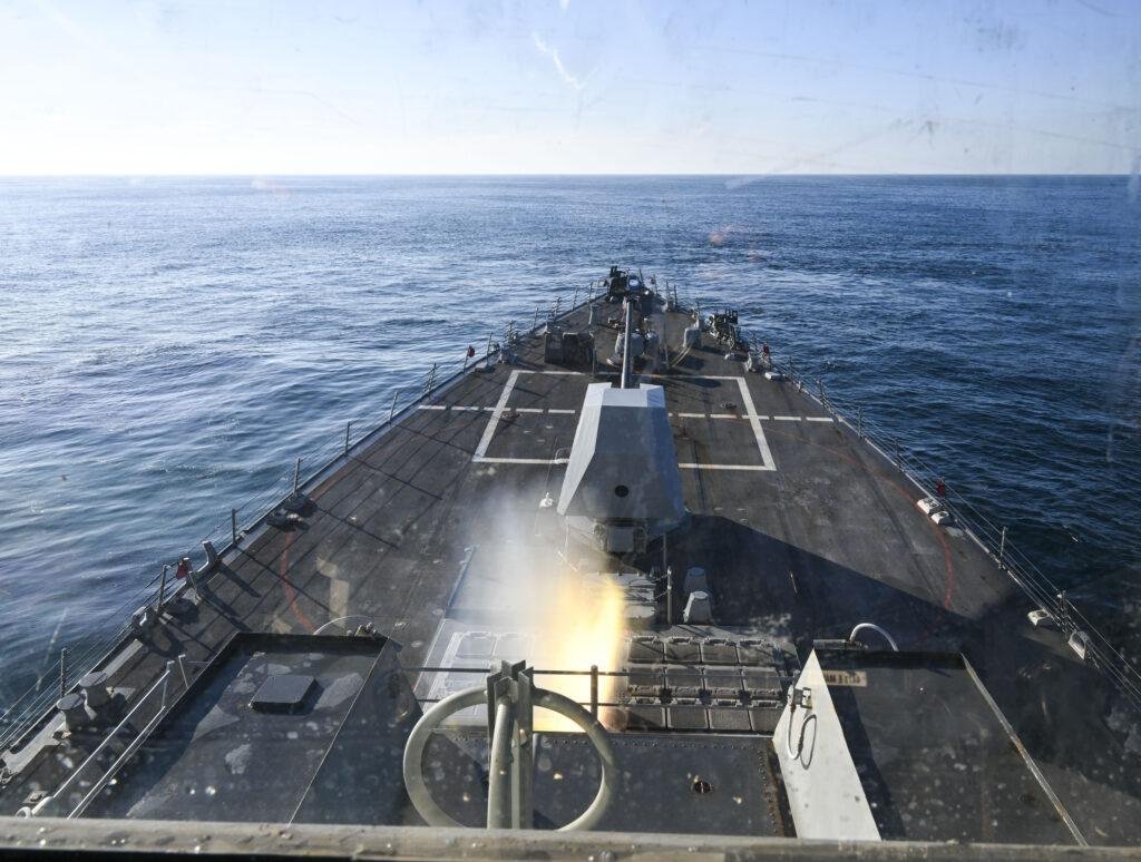Navy destroyer launching a missile in a flash of fire and smoke, a file photo for the SM-6 contract