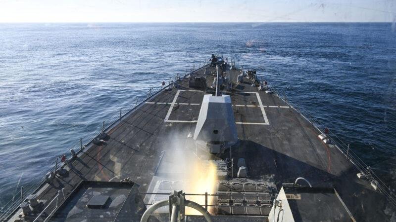 Navy destroyer launching a missile in a flash of fire and smoke, a file photo for the SM-6 contract